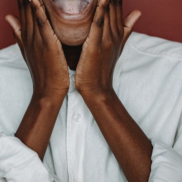 Smiling person feeling energetic and refreshed after a workout.